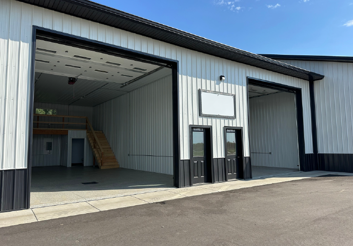 yankton 2 Modern industrial warehouse with open garage doors.